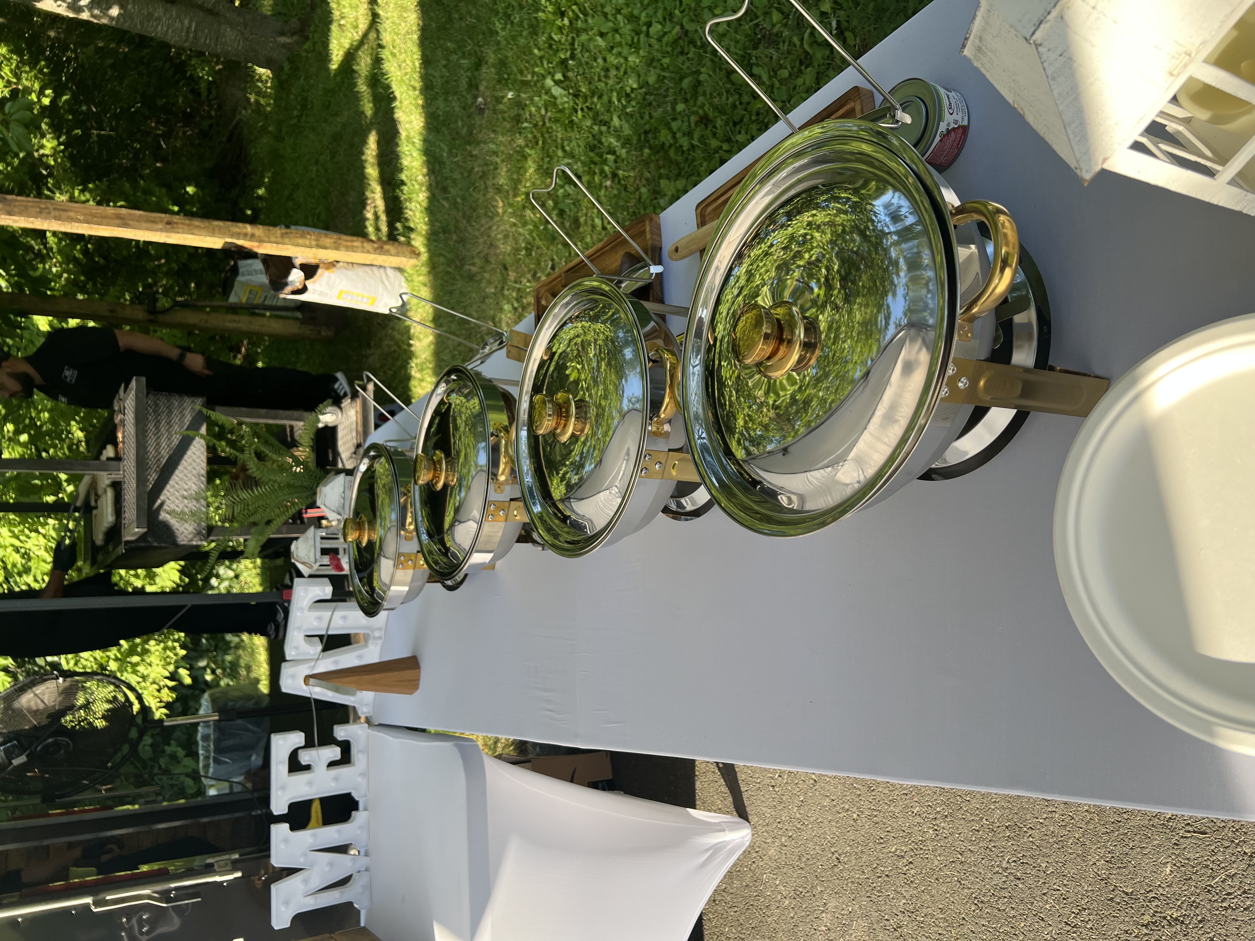 Milestone anniversary party catering with elevated Brazilian BBQ spread and celebration decor