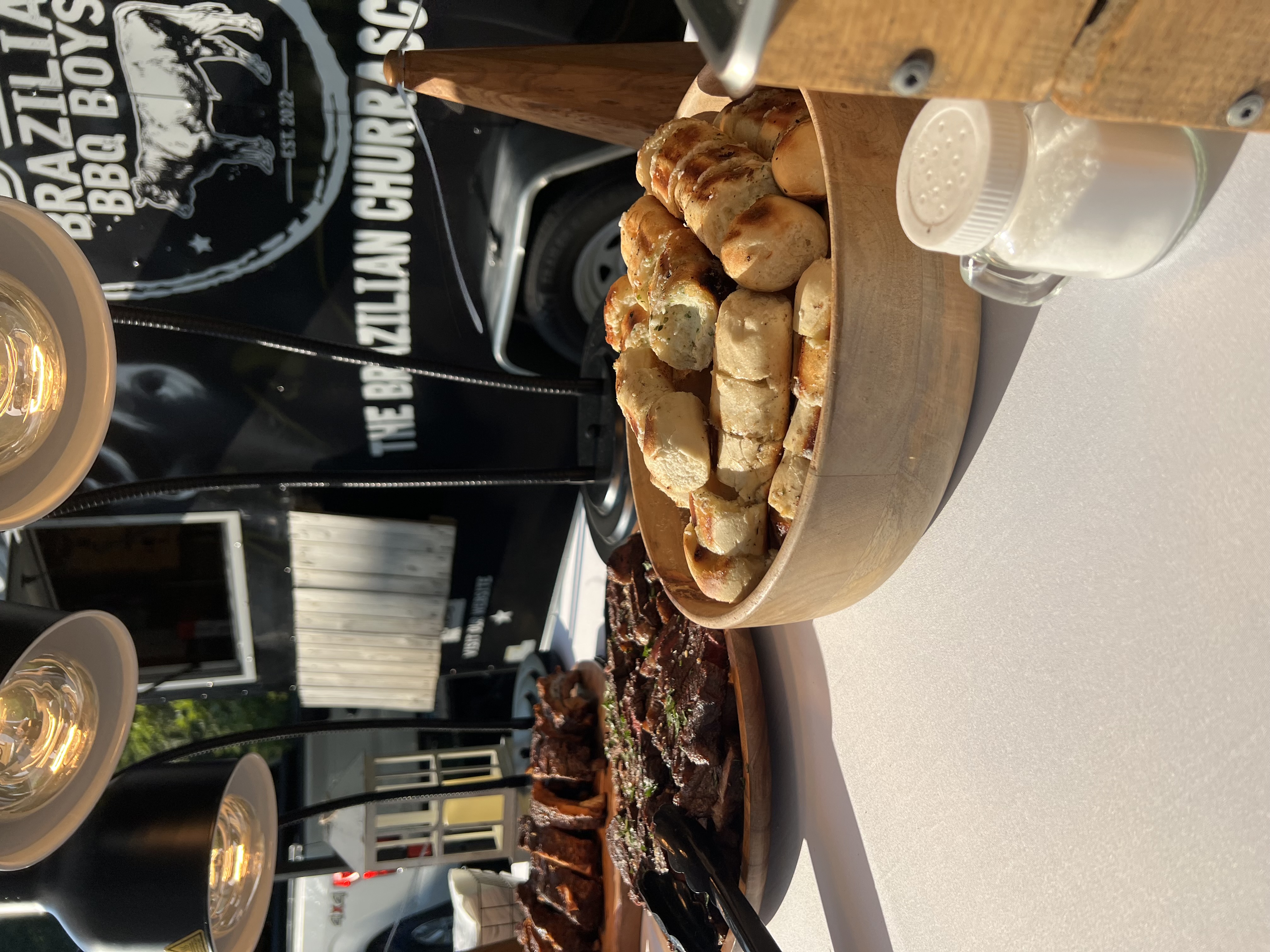 Backyard wedding reception with Brazilian BBQ catering under a tent on a Connecticut estate